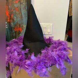 Gently used Witch hat with purple feathers